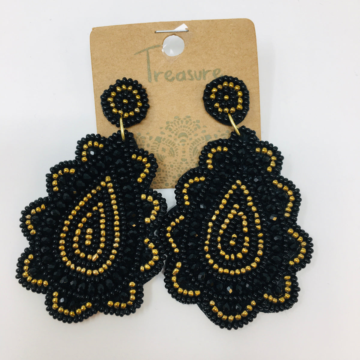 Scalloped teardrop shaped earrings with black &amp; gold colored seed beads shown on white background