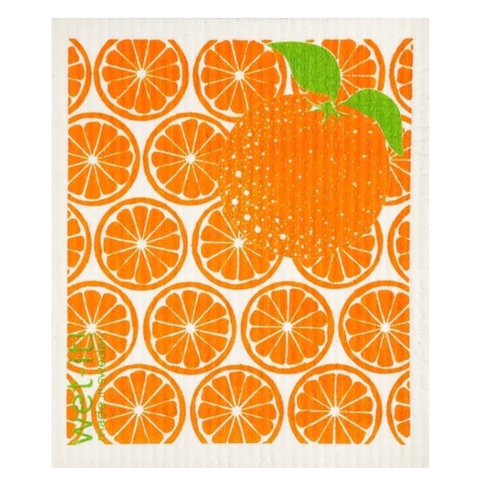 ivory colored rectangle shaped scrubbing pad with repeating pattern of bright orange slices all over as a background and 1 large orange with green leaves attached on the upper right corner screen printed on it