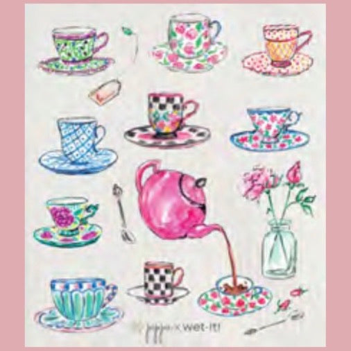 ivory colored rectangle shaped scrubbing pad with a variety of teacups and a teapot in pastel colored patterns and designs  screen printed on it