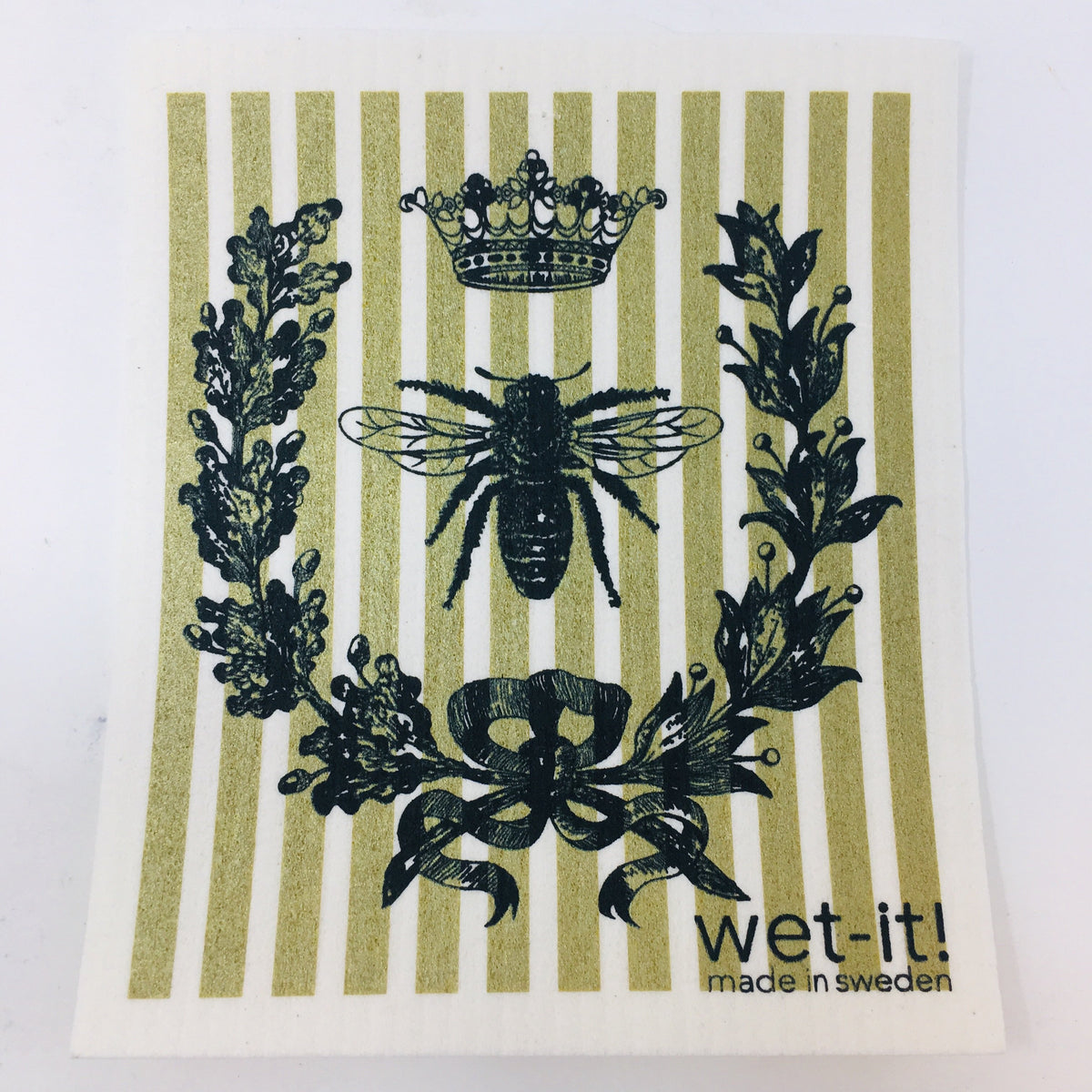 ivory colored rectangle shaped scrubbing pad with a black crown of flowers around a bee with a crown above it on top of a gold striped background screen printed on it