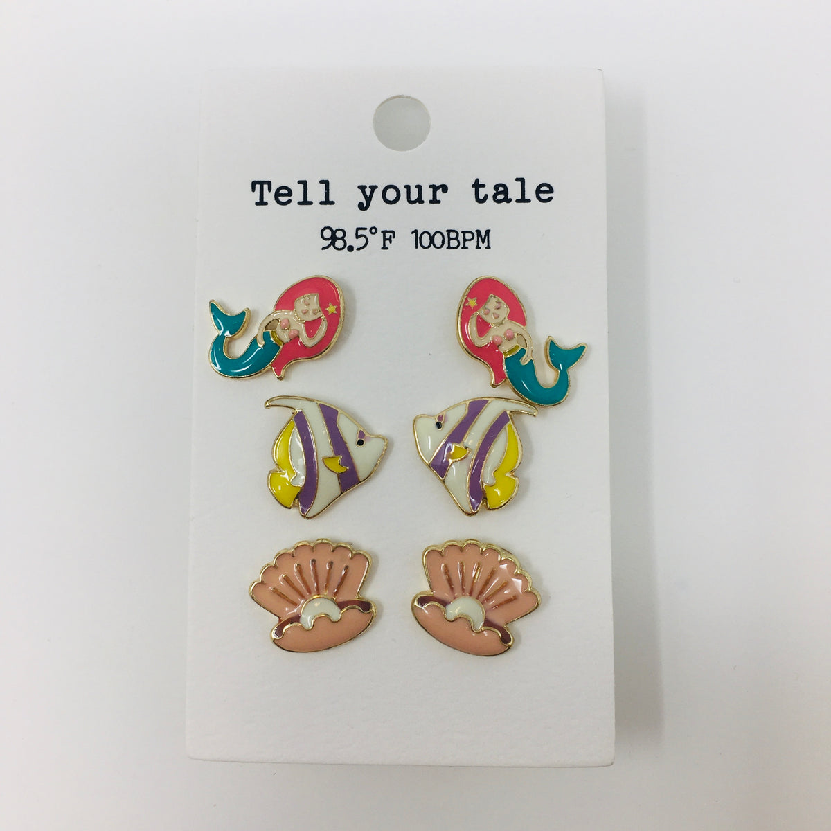 Set of 3 enamel colored post earrings on an ivory backer card showing mermaids, angel fish, and seashells