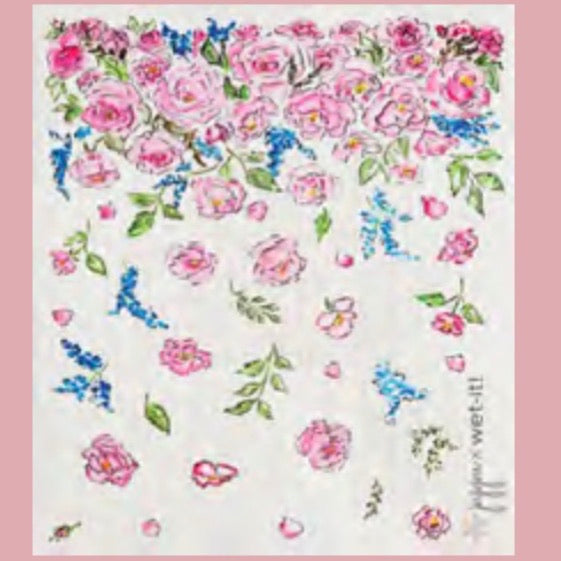ivory colored rectangle shaped scrubbing pad with dainty pink roses, blue flowers, and green leaves scattered all over screen printed on it