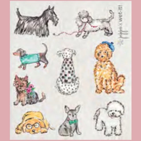 ivory colored rectangle shaped scrubbing pad with 9 different dog breeds hand drawn and nicely colored in with a colored pencil look  screen printed on it