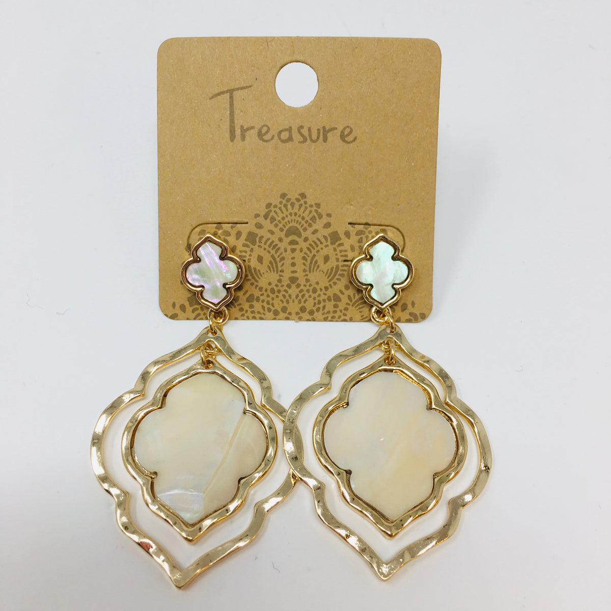double layer arabesque shaped gold tone earrings with mother of pearl inserts shown on a white background