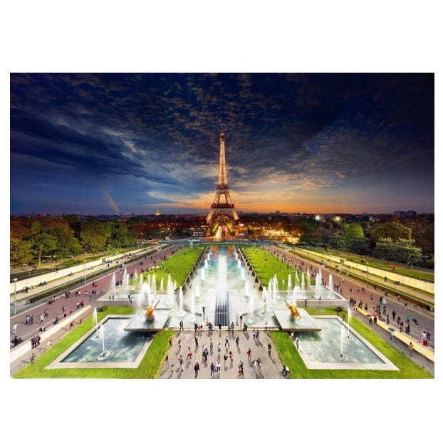 Stephen Wilkes Day to Night Eiffel Tower Paris puzzle image that shows a view of the Eiffel Tower through a time lapse of 24-36 hours exposing day and night in different parts of the photo