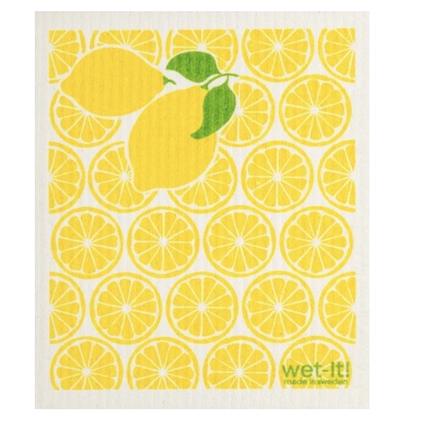 ivory colored rectangle shaped scrubbing pad with repeating pattern of bright yellow lemon slices all over as a background and 2 large lemons with green leaves attached on the upper left corner screen printed on it