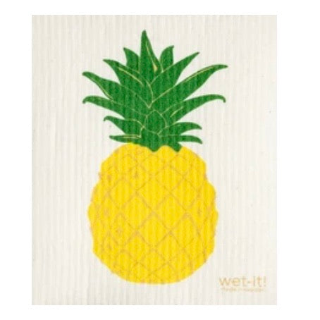 ivory colored rectangle shaped scrubbing pad with a large yellow pineapple with green top screen printed on it